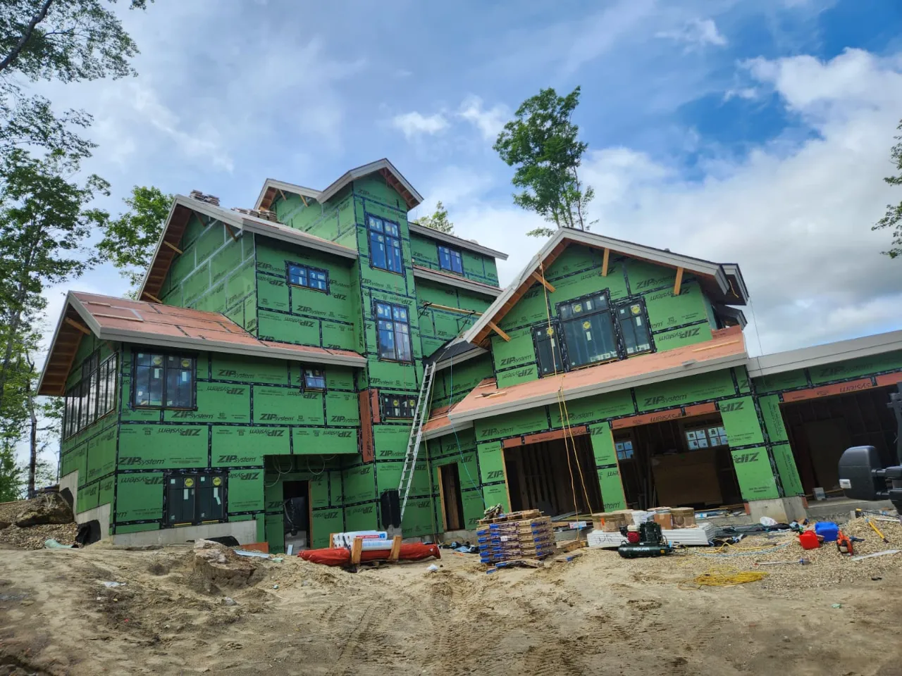 Roofing crew working on a residential roof in Vermont