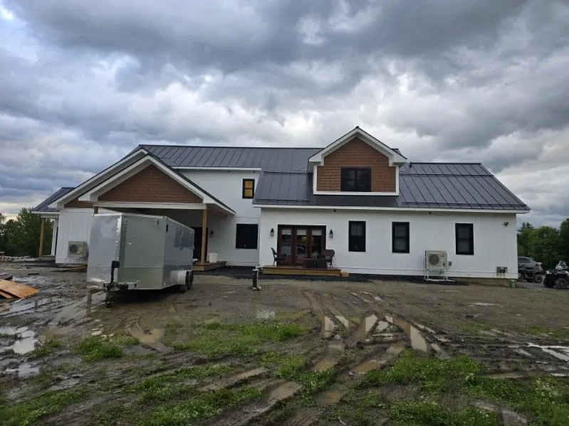 Roofing crew working on a residential roof in Vermont