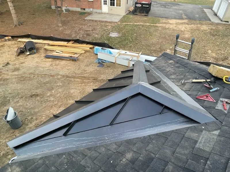 Roofing crew working on a residential roof in Vermont