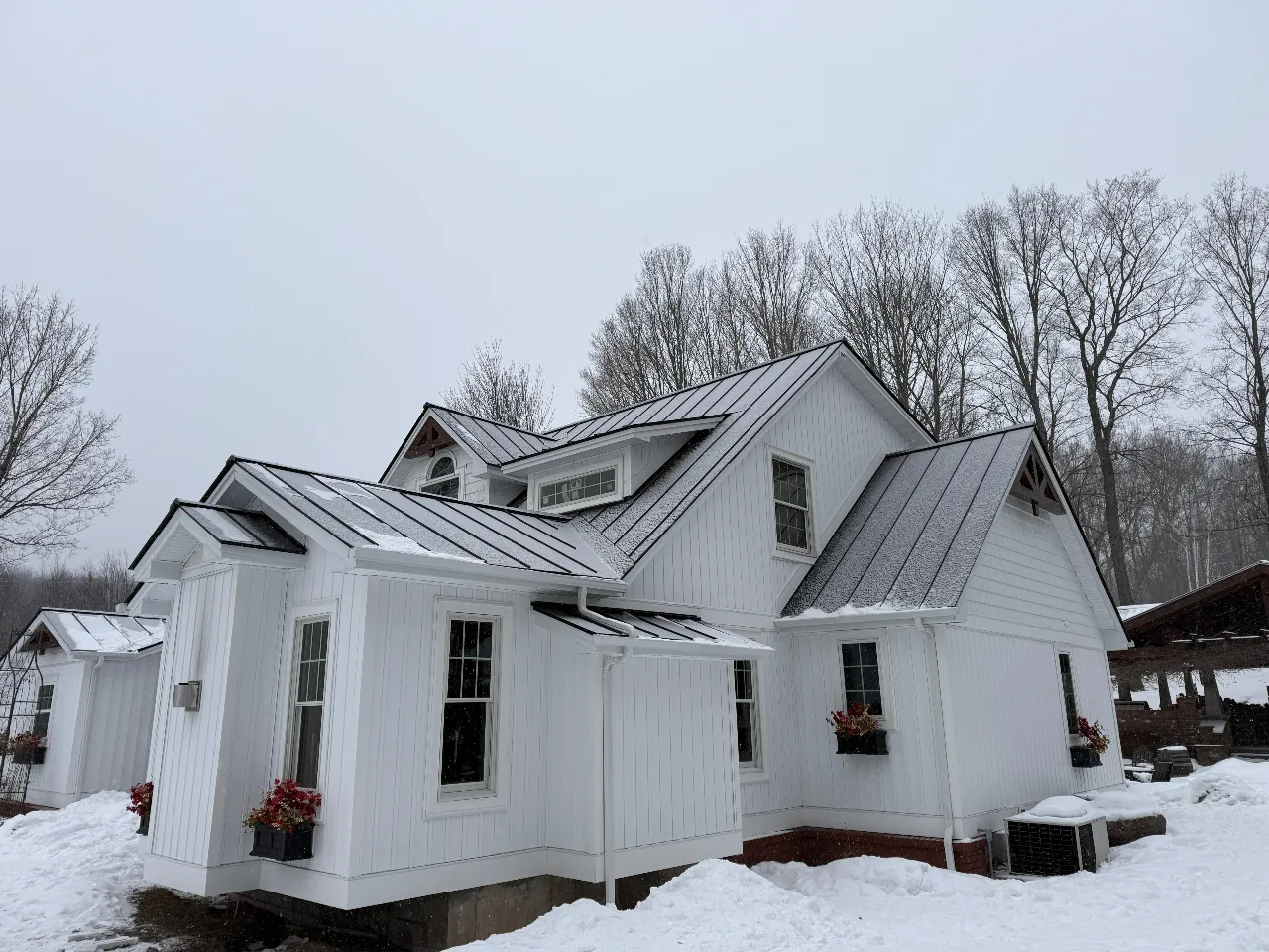 Roofing crew working on a residential roof in Vermont