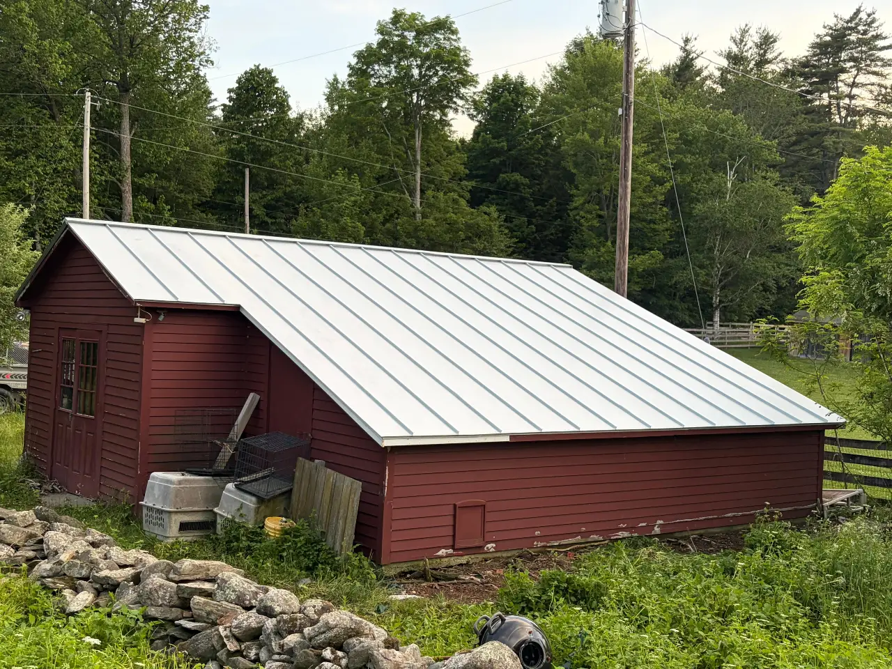Roofing crew working on a residential roof in Vermont