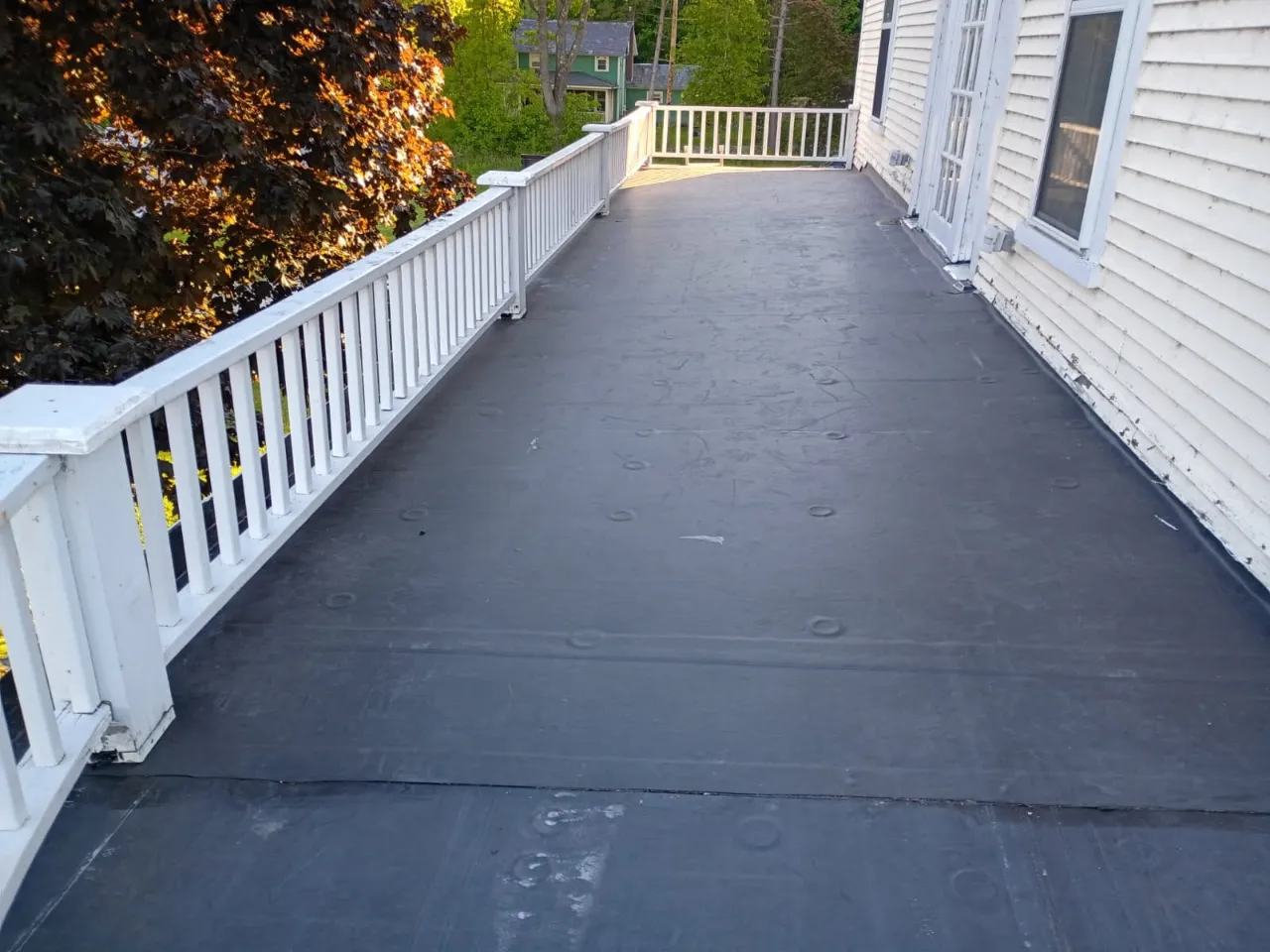 Roofing crew working on a residential roof in Vermont
